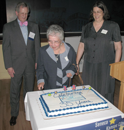 Former LSC Board member Ramona Shump helps celebrate LSC's 35th anniversary. Chairman Strickland and Kansas Legal Services Executive Director Marilyn Harp look on.