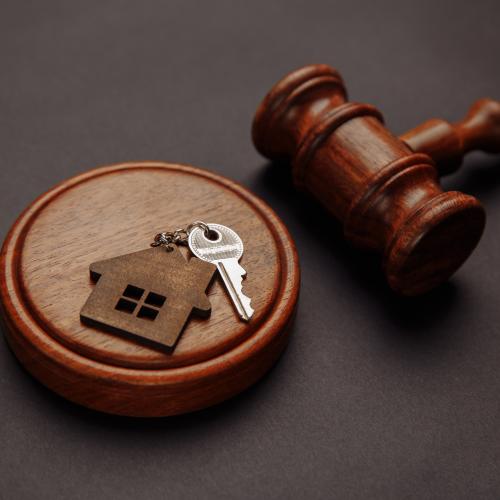 gavel and keys with house shaped keychain