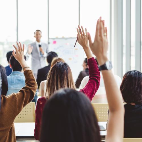 photo of people raising their hands