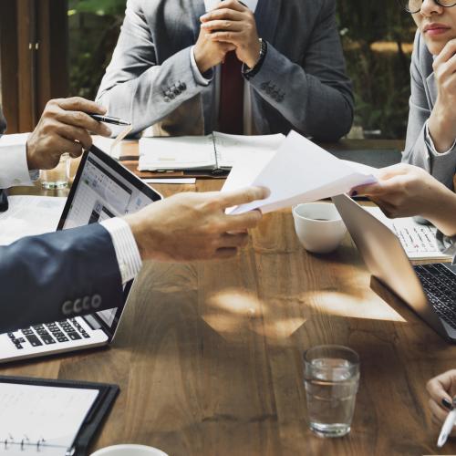 photo of people working at a table